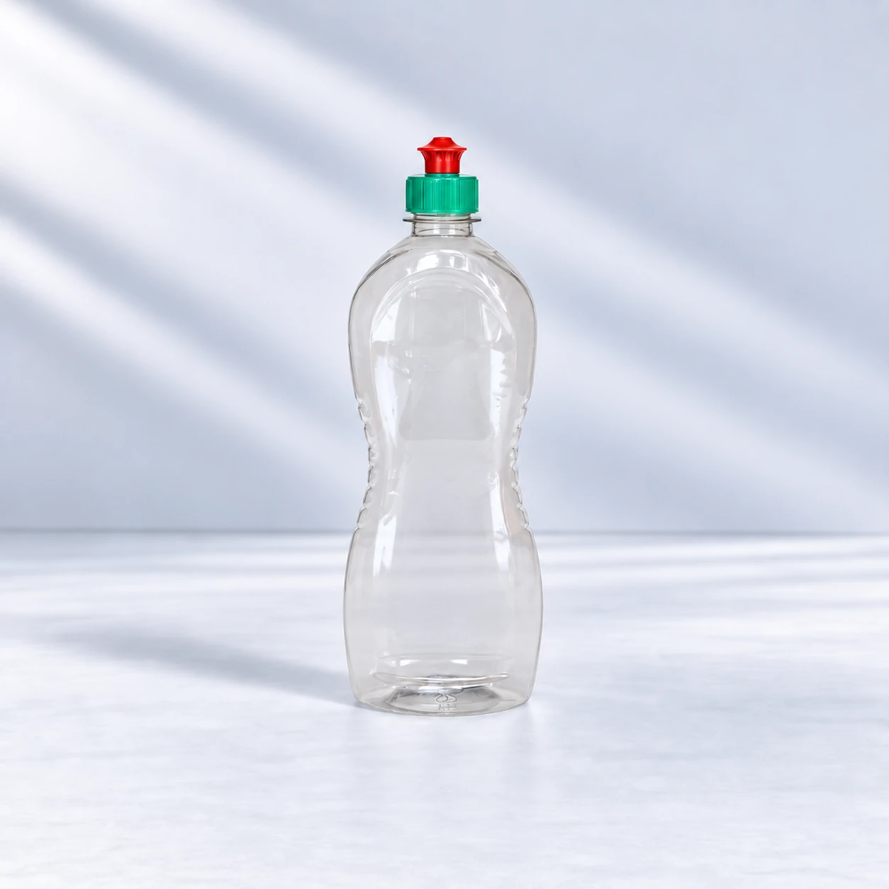 Clear 750 ml PET dishwashing liquid bottle with a green and red dispensing cap